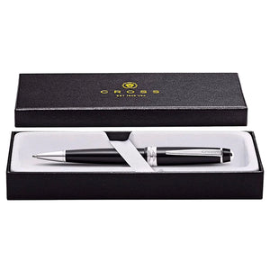 Black and silver ballpoint pen in an elegant gift box with cushioned interior.