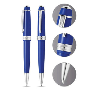 Blue luxury ballpoint pens with silver accents, close-up details, premium writing instrument