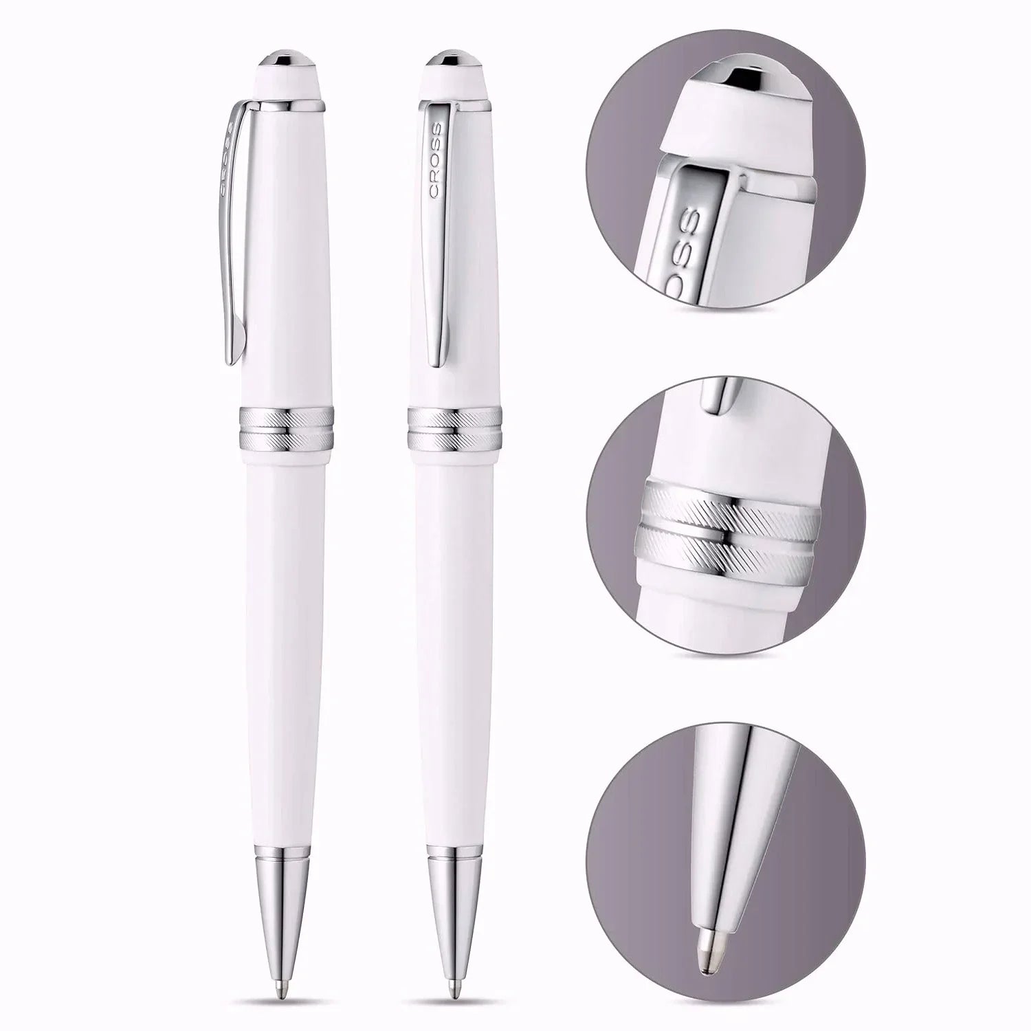 White luxury ballpoint pens with chrome accents and close-up details on a white background