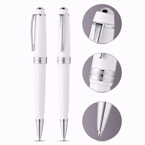 White luxury ballpoint pens with chrome accents and close-up details on a white background