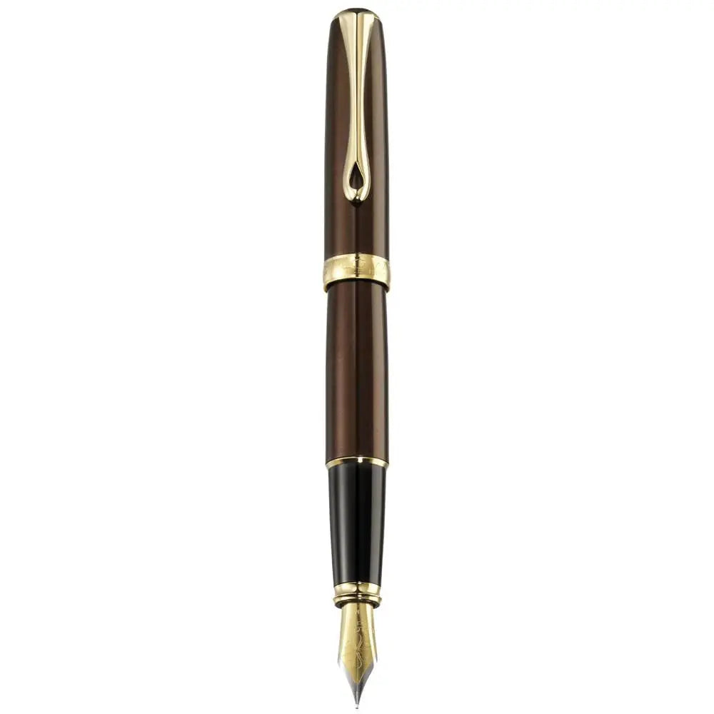 Luxury brown and gold fountain pen with gold nib on white background